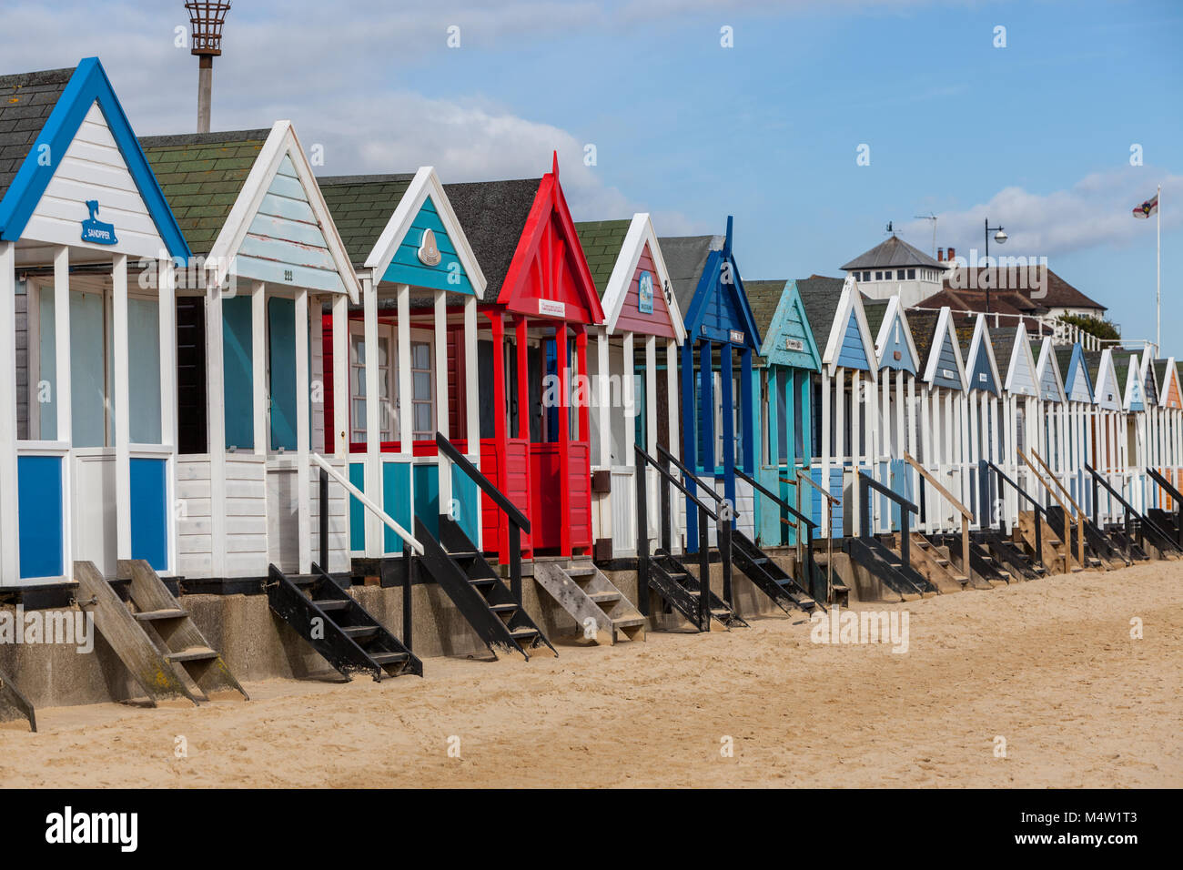 row of coulourful beach huts on southwold seafront in suffolk uk Stock Photo