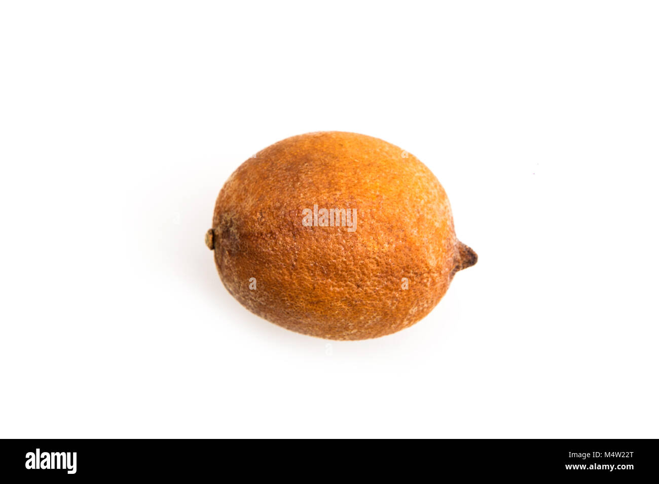 A picture of one old and overripe lemon. The peel is almost dry, but inside the pulp is good and full of vitamins. Stock Photo