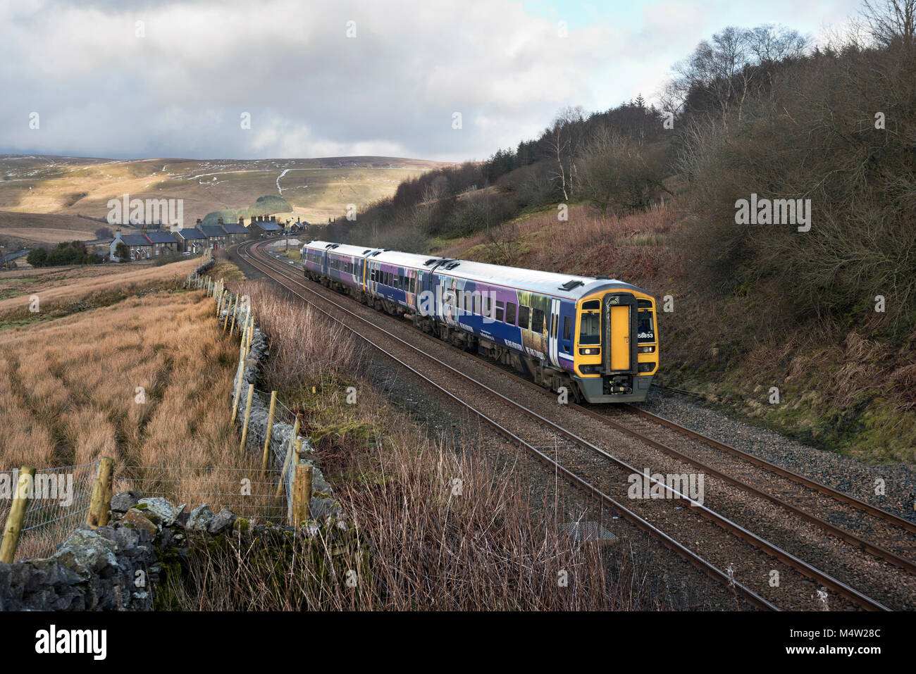 Sprinter passenger train from Carlisle passes through Garsdale in the Yorkshire Dales National park, en route for Leeds, UK. Stock Photo