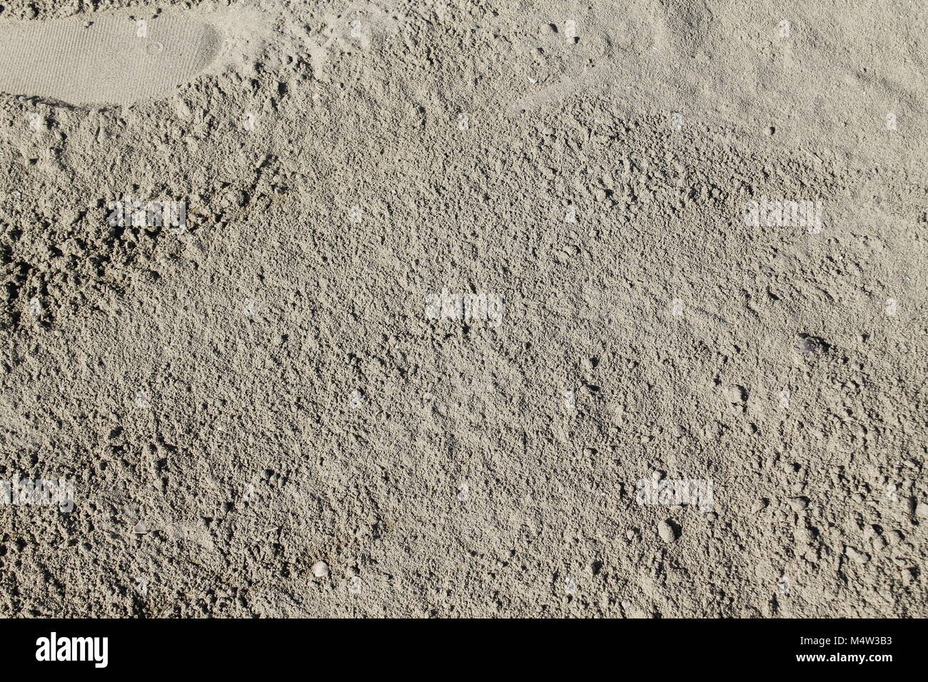 Sand on the the beach as background Stock Photo - Alamy