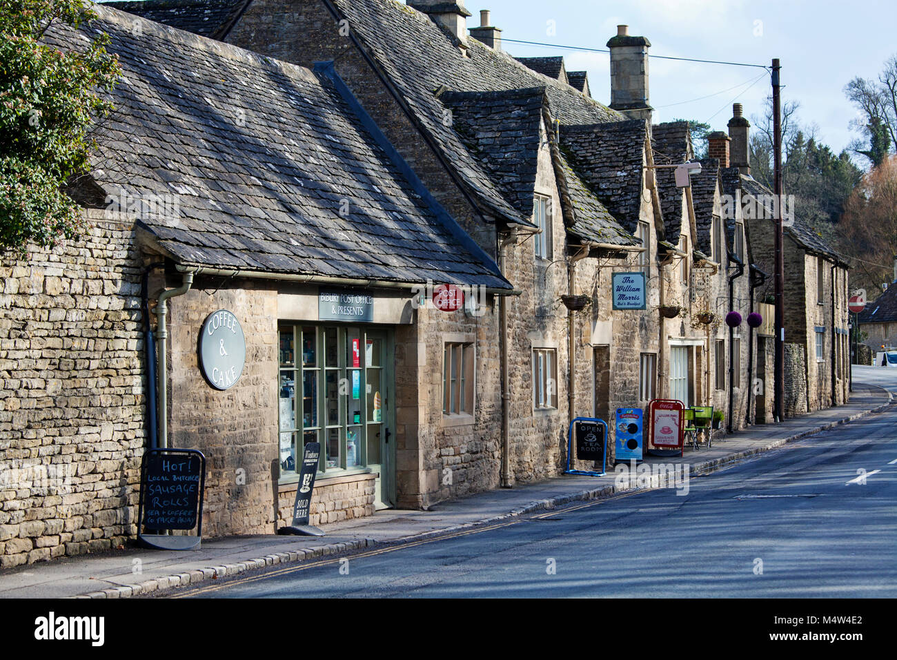BIBURY, UK - FEBRUARY 15th, 2018: Old cottages in Bibury: Bibury is a typical Costwold village with traditional english architecture. Stock Photo