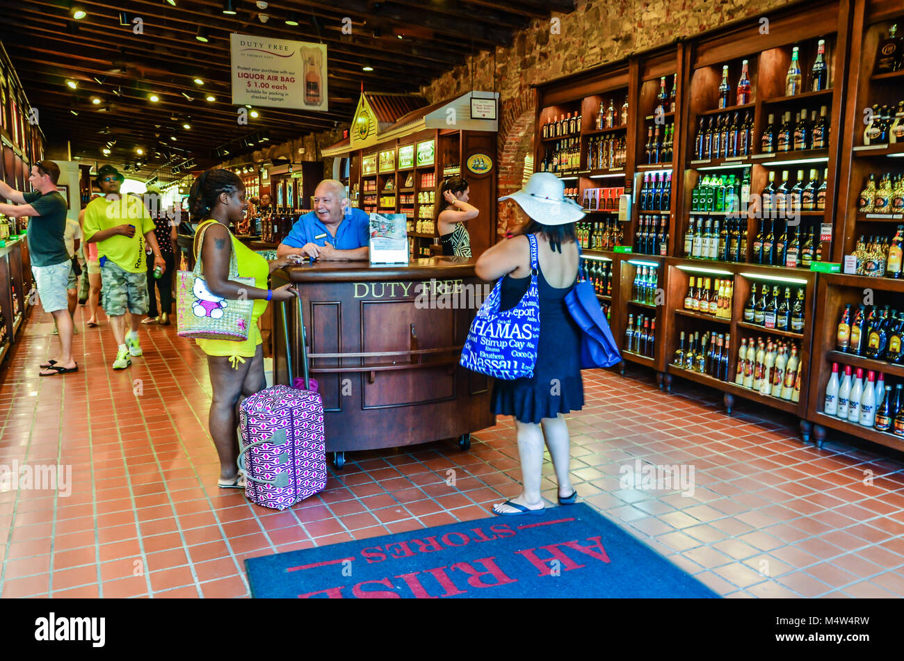 Tourists shopping at a duty free liquor store in Charlotte Amalie on the island of St. Thomas in the U.S.Virgin Islands. Stock Photo