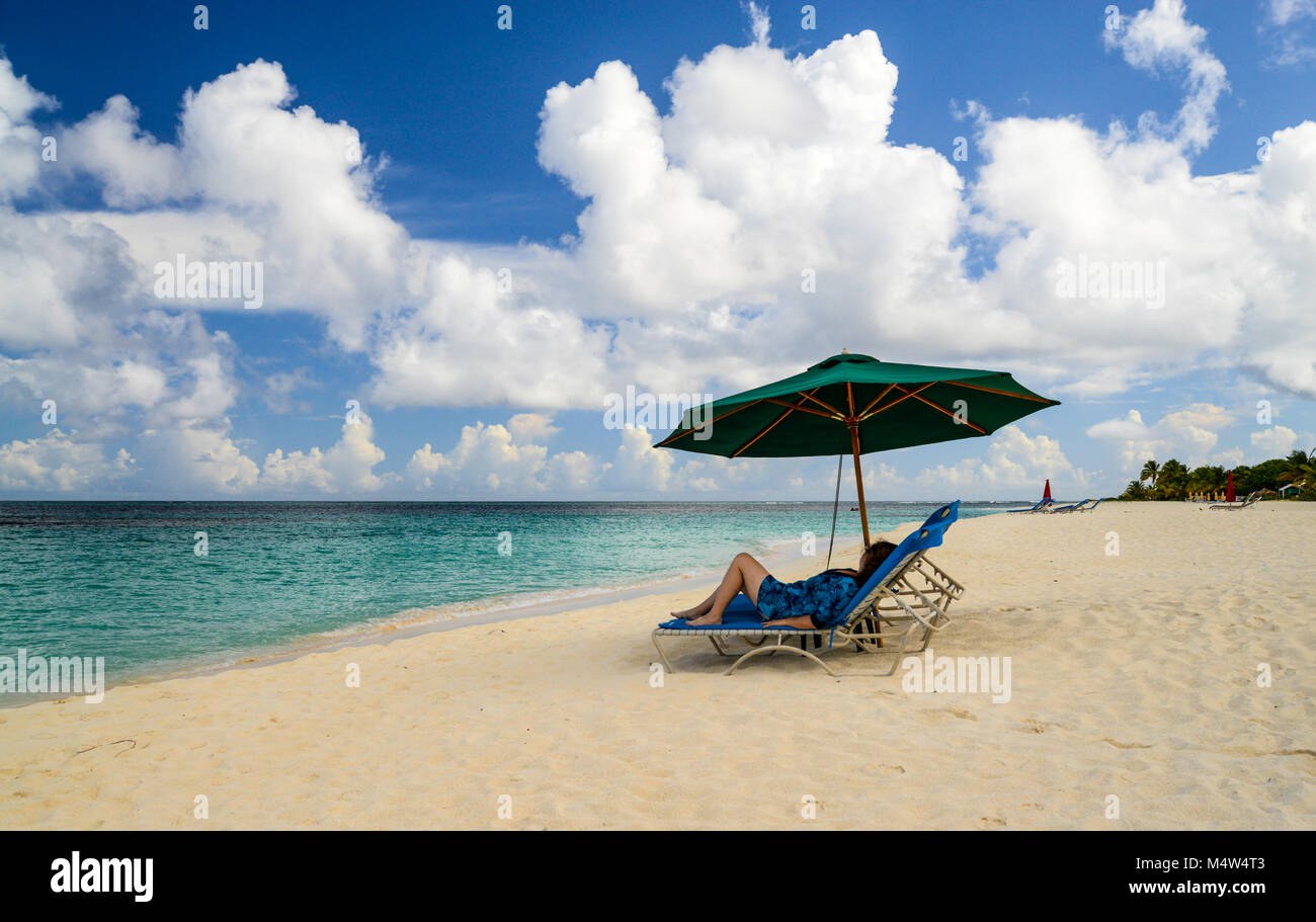 Female beach umbrella hi-res stock photography and images - Alamy