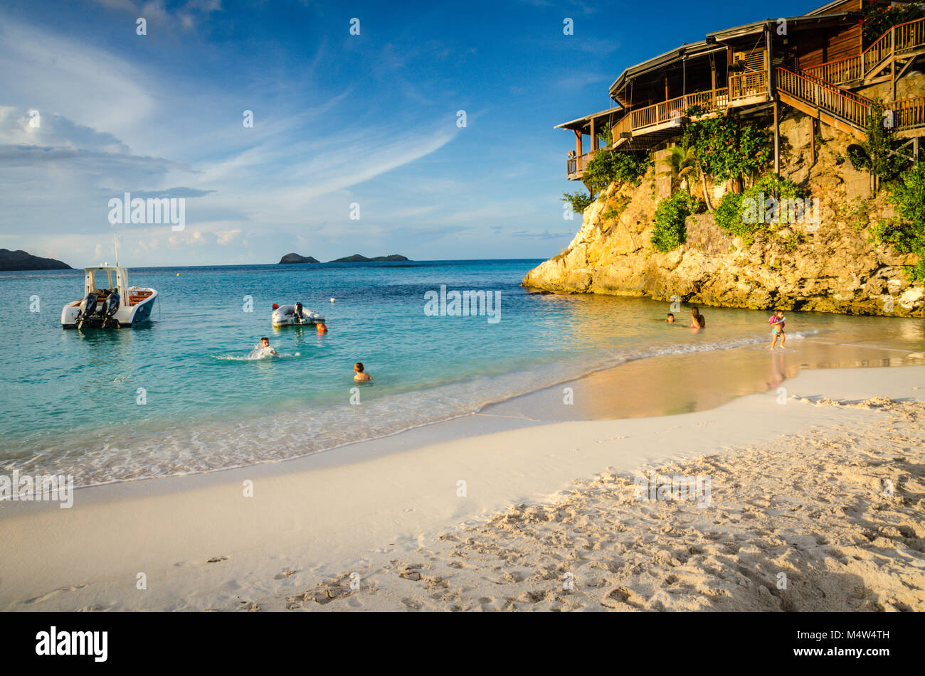 Family swimming and playing on shore at the beach next to Eden Rock Hotel in St. Barths. Stock Photo