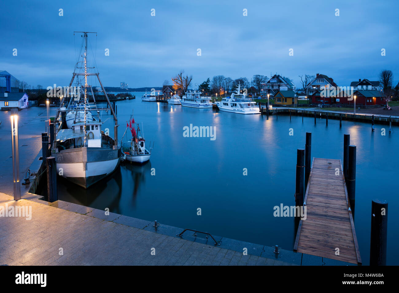 Baltic Sea harbour with boats at dusk, Niendorf, Timmendorfer Strand, Bay of Lübeck, Schleswig-Holstein, Germany Stock Photo