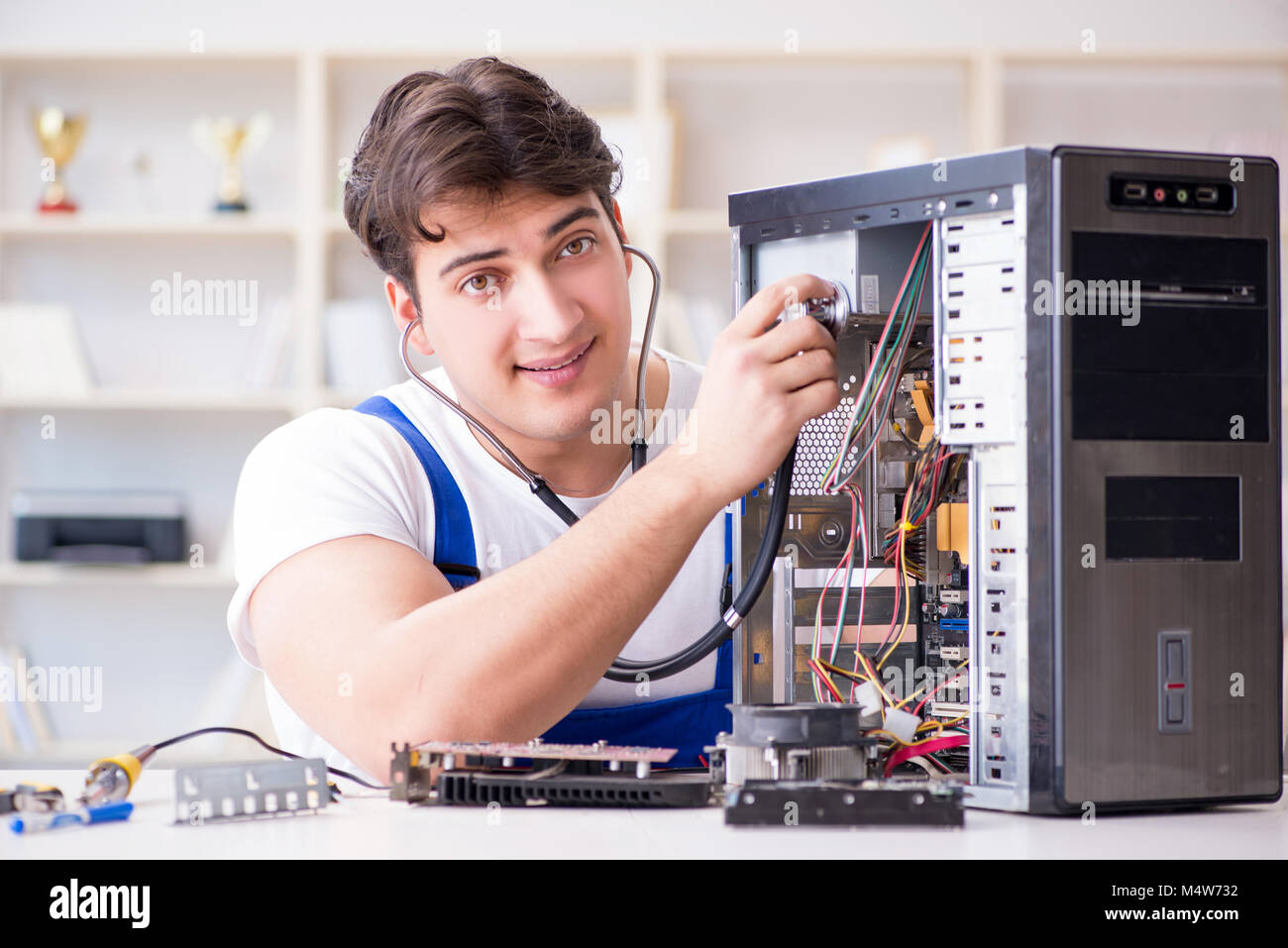 Computer repairman repairing desktop computer Stock Photo - Alamy