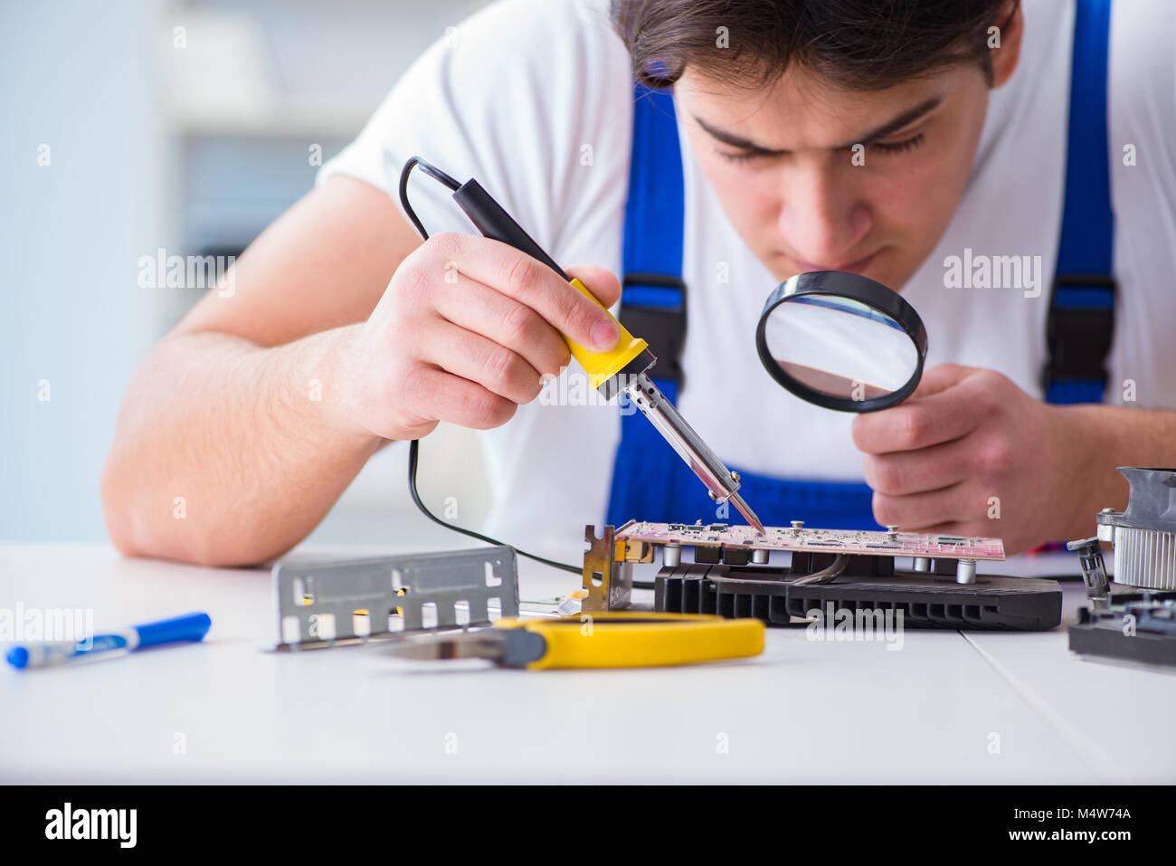 Computer repairman repairing desktop computer Stock Photo - Alamy