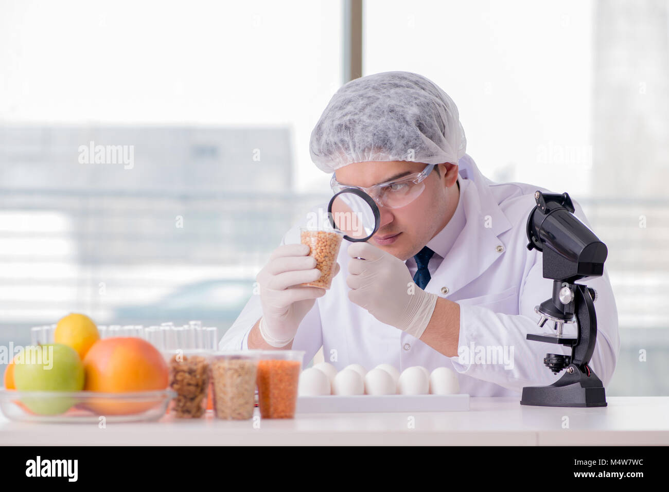 Nutrition expert testing food products in lab Stock Photo Alamy