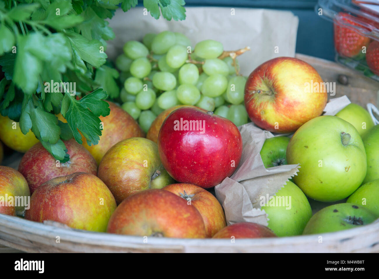A variety of fruits on display in a container Stock Photo Alamy
