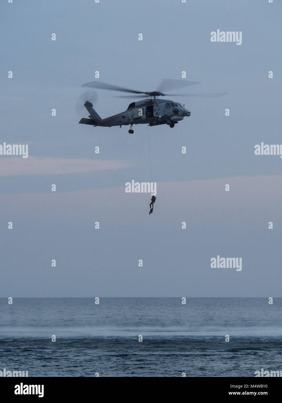 Soldier rescue demostration with a helicopter Stock Photo - Alamy