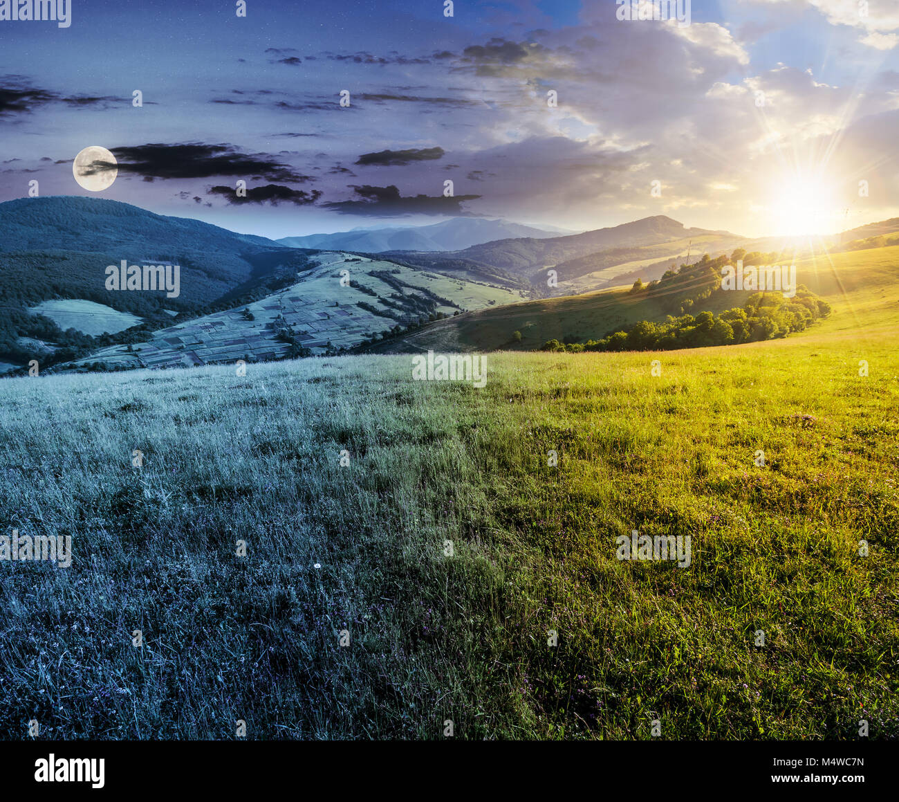 time change concept over the grassy meadow in mountains. beautiful summer countryside under the gorgeous sky, sun and moon Stock Photo