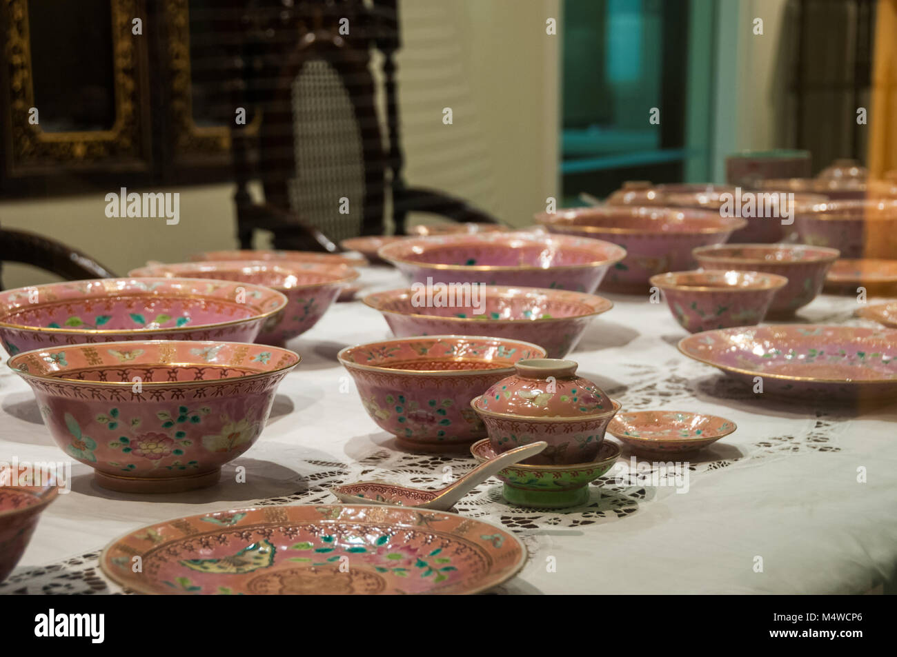 Nonyaware laid out on a table at the Peranakan Museum, Singapore. Stock Photo