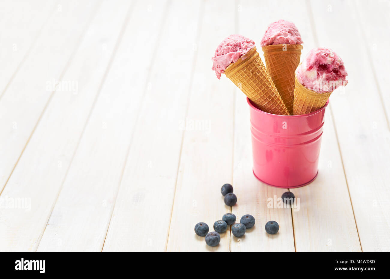 Blueberry ice cream cones in mini bucket Stock Photo