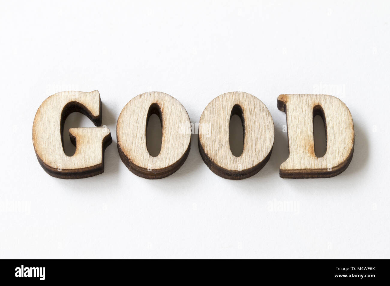 GOOD, Wood letters good on White background Stock Photo - Alamy