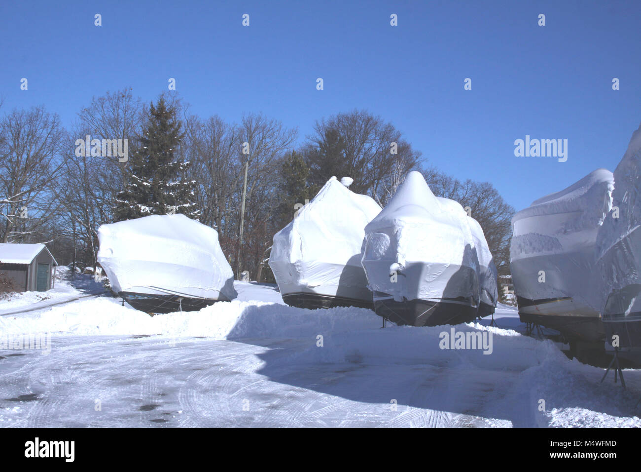 Plastic shrink wrap on boat, to protect boats and interior of boats