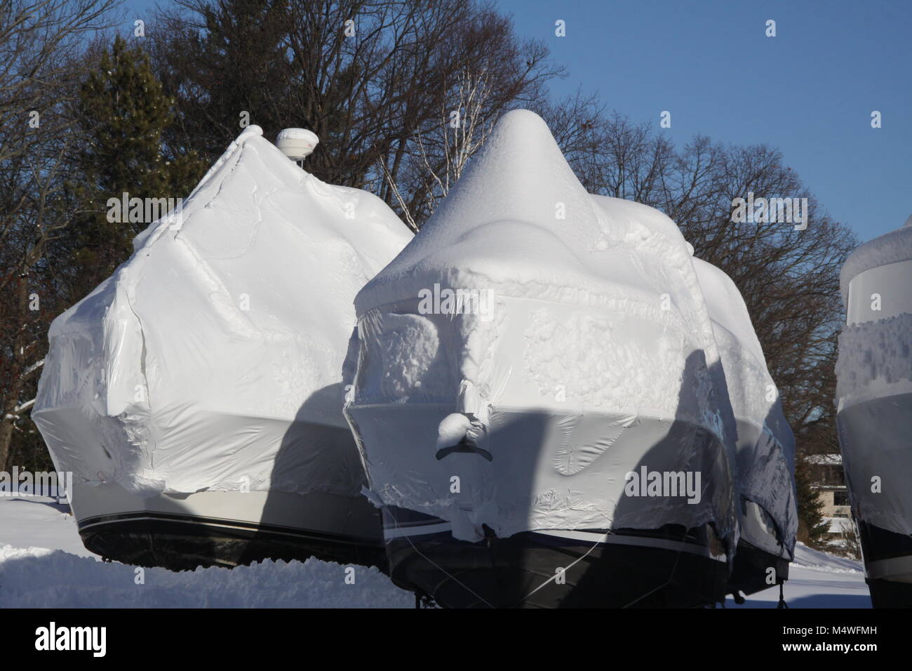 Plastic shrink wrap on boat, to protect boats and interior of boats