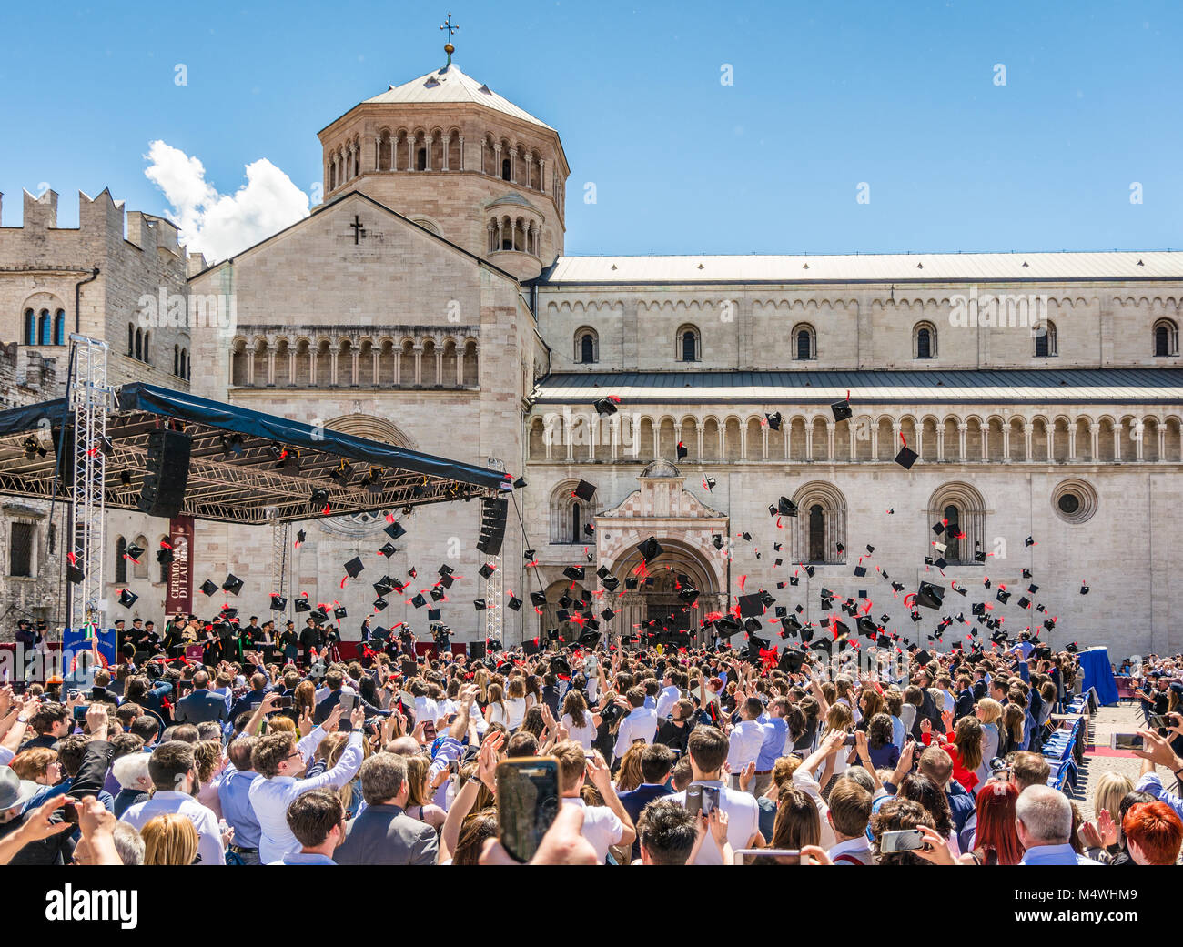 the graduation ceremony in the main square of the city of Trento, italy. The city is famous for the prestigious universities. Stock Photo
