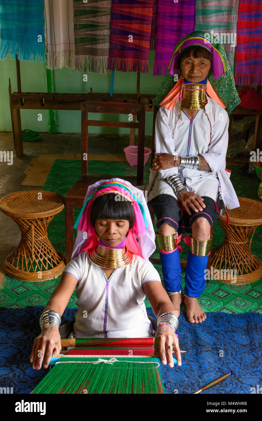 Ywama: Kayan Lahwi (Padaung) Long Neck woman weaving, weaver loom, Inle Lake, Shan State, Myanmar (Burma) Stock Photo