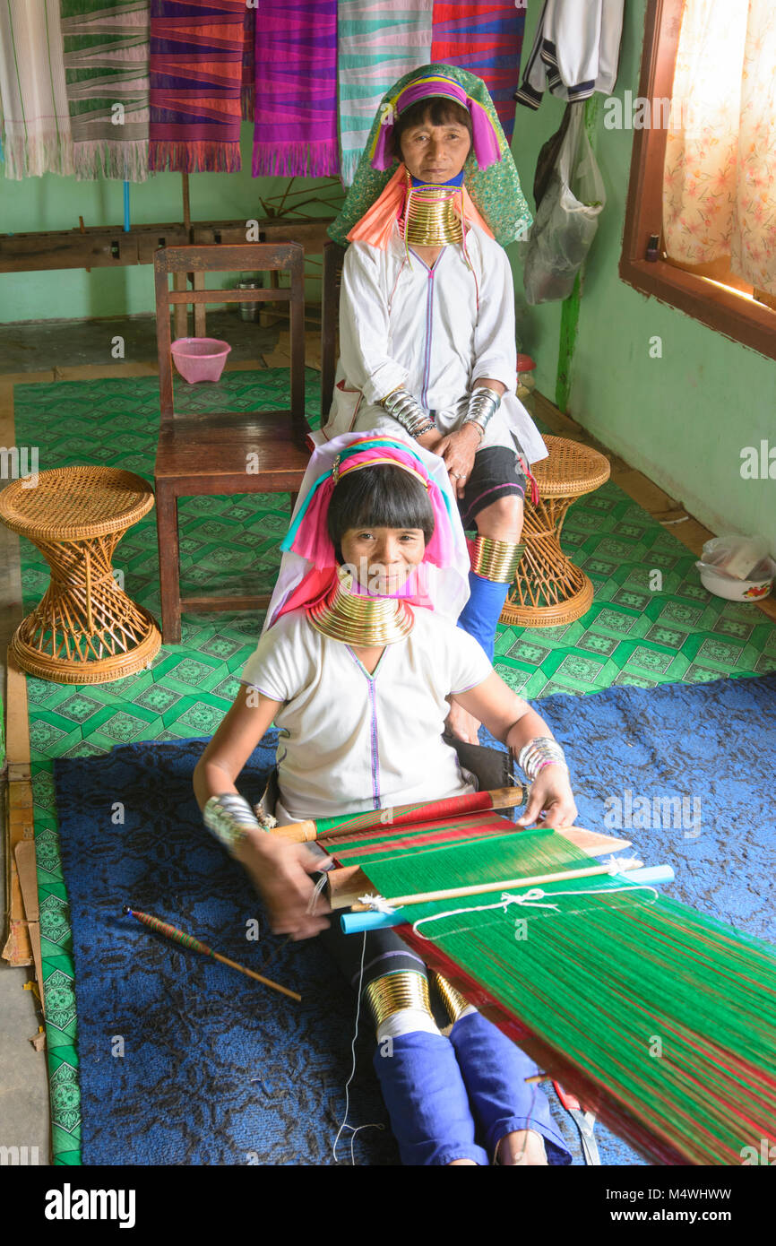 Ywama: Kayan Lahwi (Padaung) Long Neck woman weaving, weaver loom, Inle Lake, Shan State, Myanmar (Burma) Stock Photo