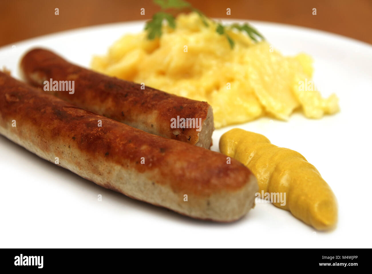 german sausage with mustard and potato salad Stock Photo Alamy