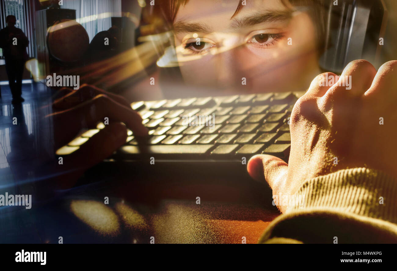teenager hands on computer keyboard, outside view Stock Photo