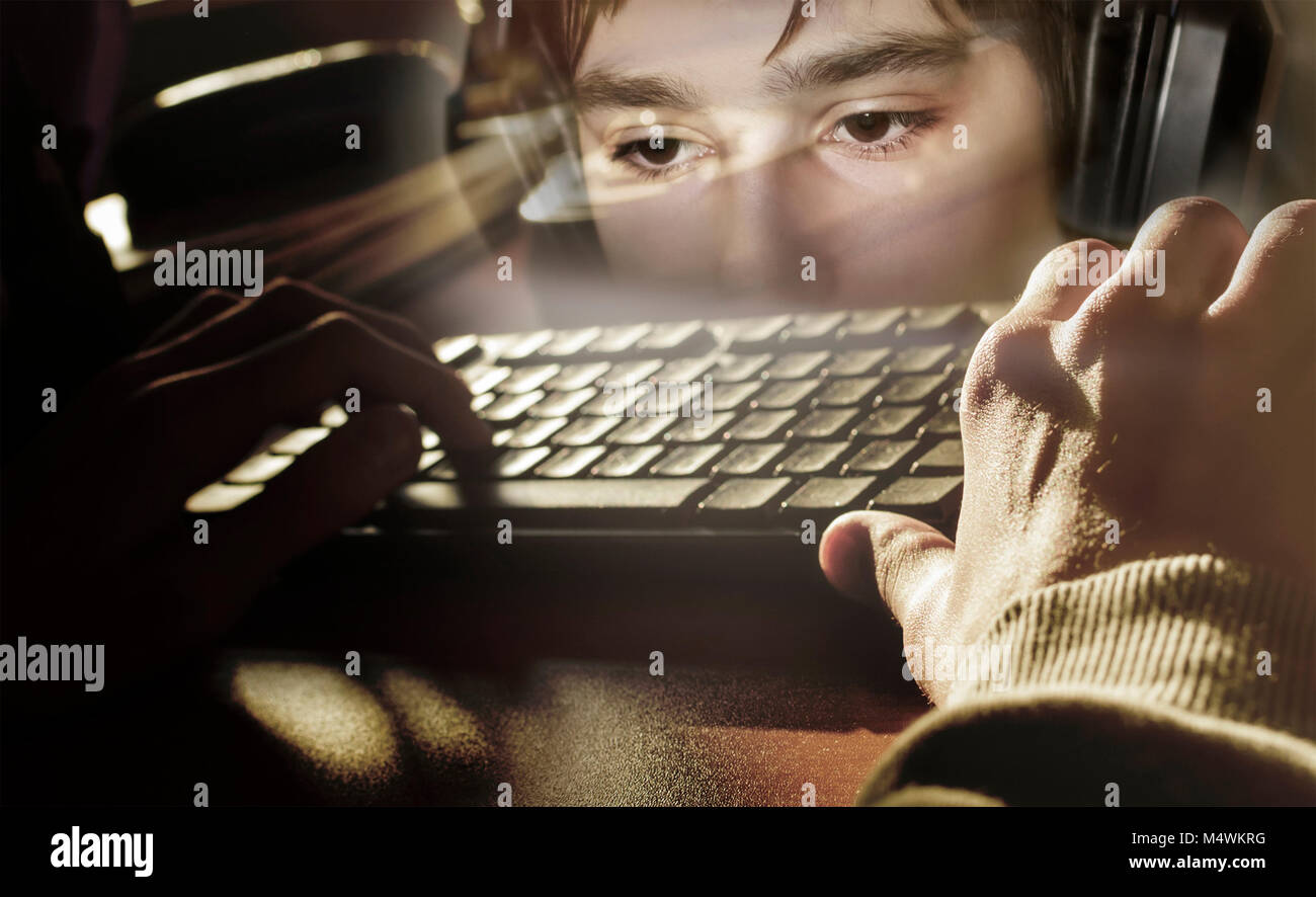 Keyboard with hands on the background of face of young boy with headphones, collage Stock Photo