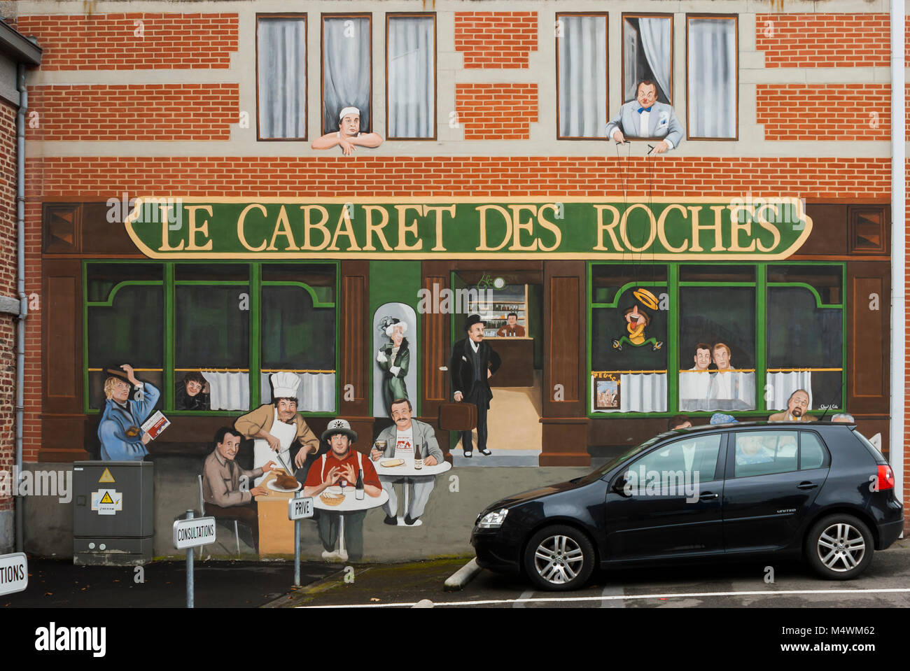 “Le Cabaret des Roches” mural in Rochefort, Belgium, depicting comedians that has marked the history of the “Festival du Rire”. Stock Photo