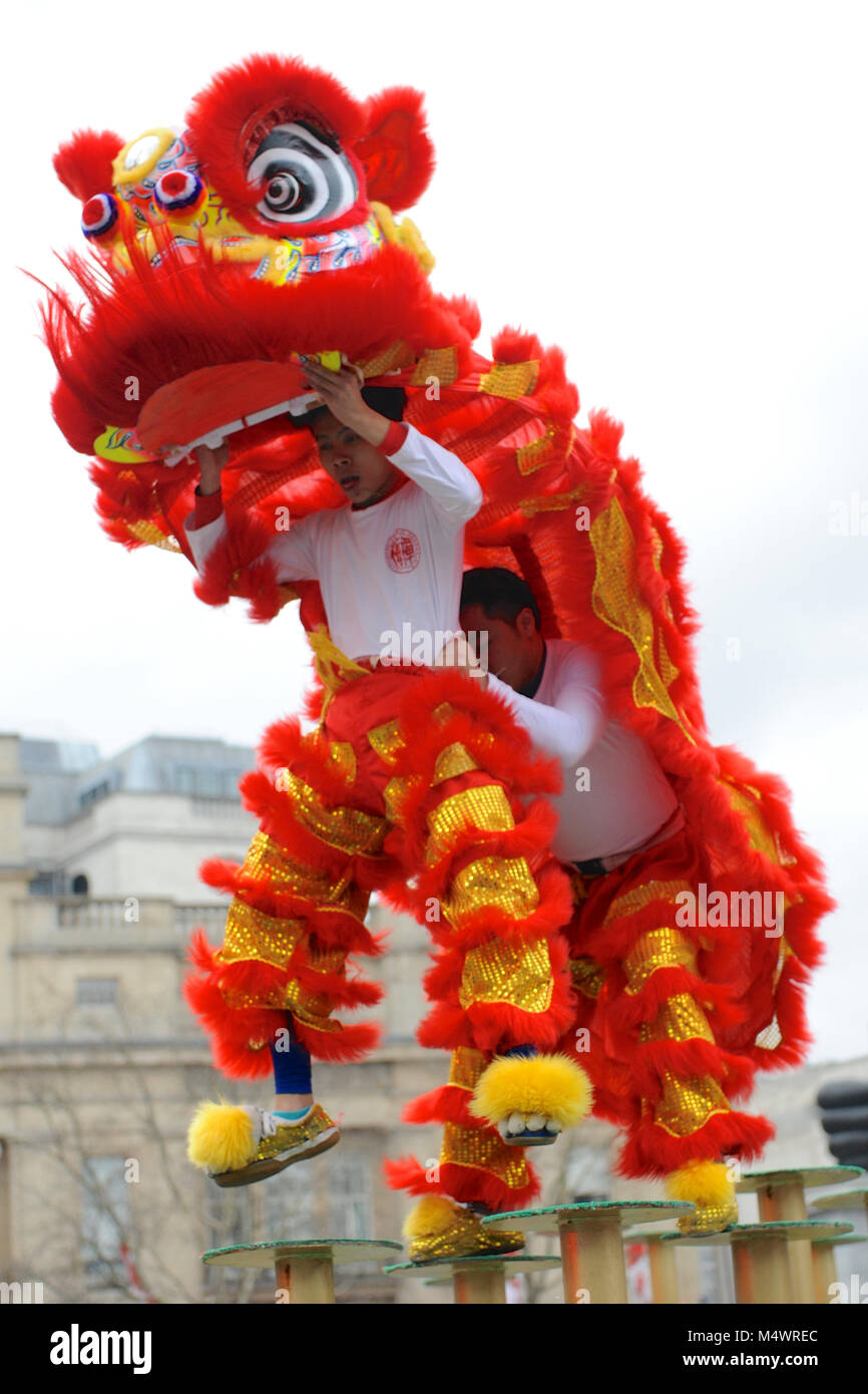 Acrobats dressed as ceremonial lions taking part in a Flying Lion Dance