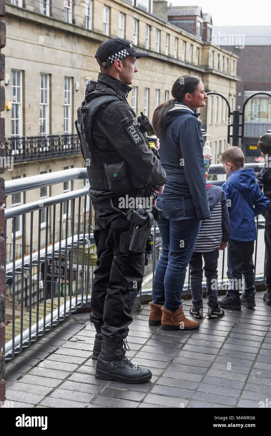 Newcastle upon Tyne, UK, 18th February 2018. Armed police keep watch as the year of the dog celebrations commence. Joseph Gaul/Alamy Live News Stock Photo