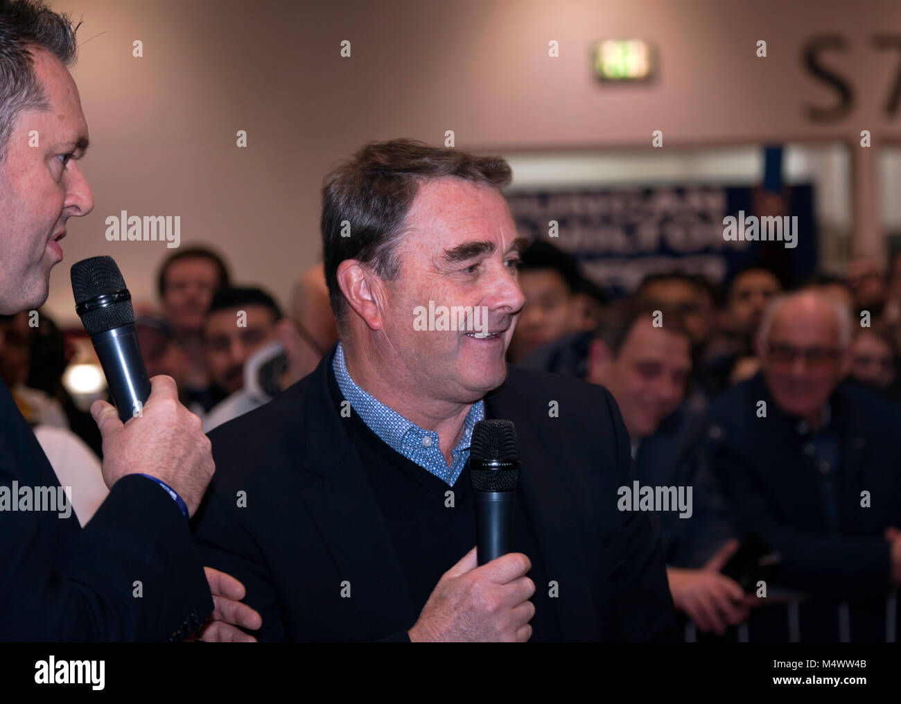 Nigel Mansell CBE  being interviewed  by Henry Hope-Frost in the Grand Avenue, during the 2018 London Classic Car Show Stock Photo