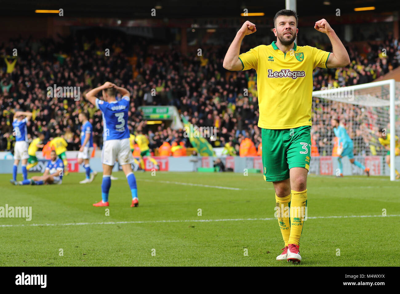 Norwich, UK. 18th Feb, 2018. Grant Hanley of Norwich City celebrates after the equalising goal from team mate, Timm Klose top make it 1-1 - Norwich City v Ipswich Town, Sky Bet Championship, Carrow Road, Norwich - 18th February 2018. Credit: Richard Calver/Alamy Live News Stock Photo