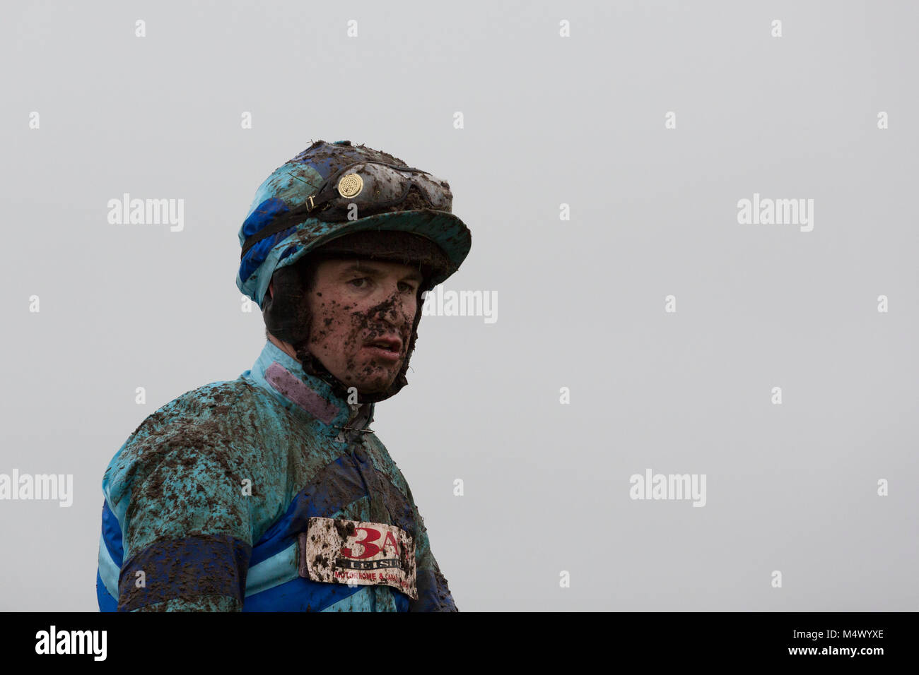 Ffos Las Racecourse, Trimsaran, Wales, UK. 18th Feb, 2018. Jockey Robert Dunne after finishing second on Lac Sacre in the Professional Security Management Ltd Handicap Chase Credit: Gruffydd Thomas/Alamy Live News Stock Photo