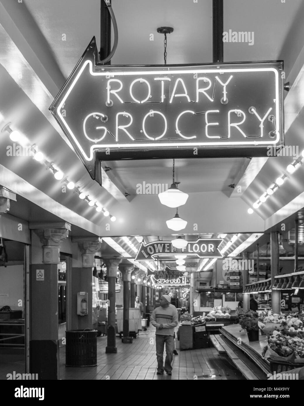 Neon sign for Rotary Grocery at Pike Place Market.  Seattle Washington Stock Photo
