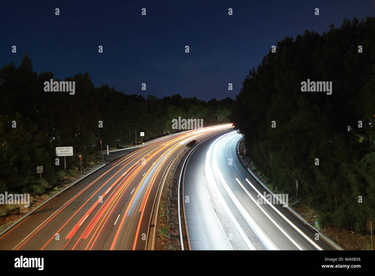 Long exposure light trails curved freeway, Sydney, Australia Stock Photo