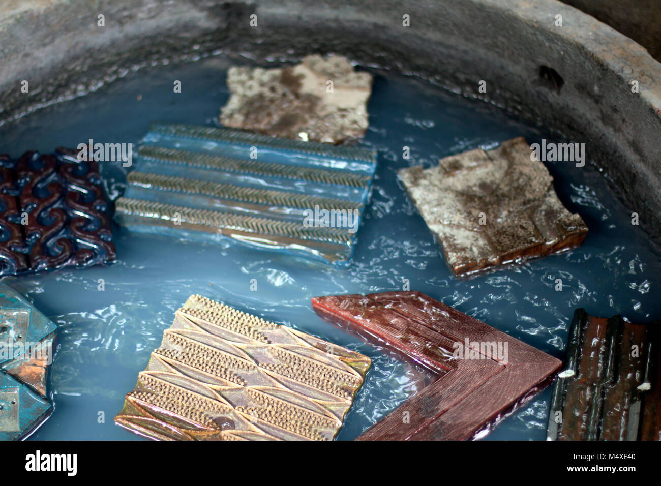 Wooden hand blocks floating in the water Stock Photo Alamy