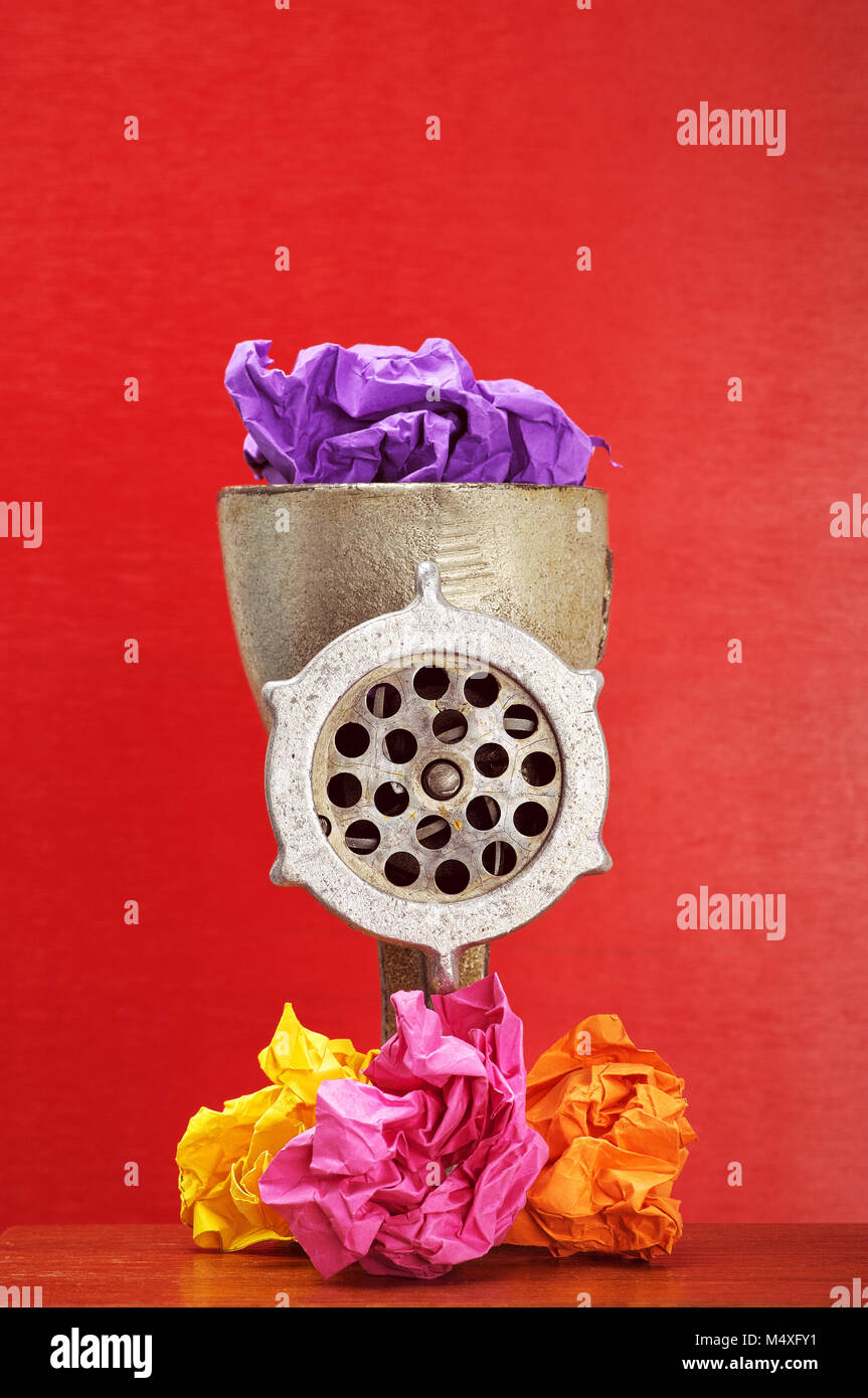meat grinder recycling garbage. vintage meat grinder and colorful paper ...