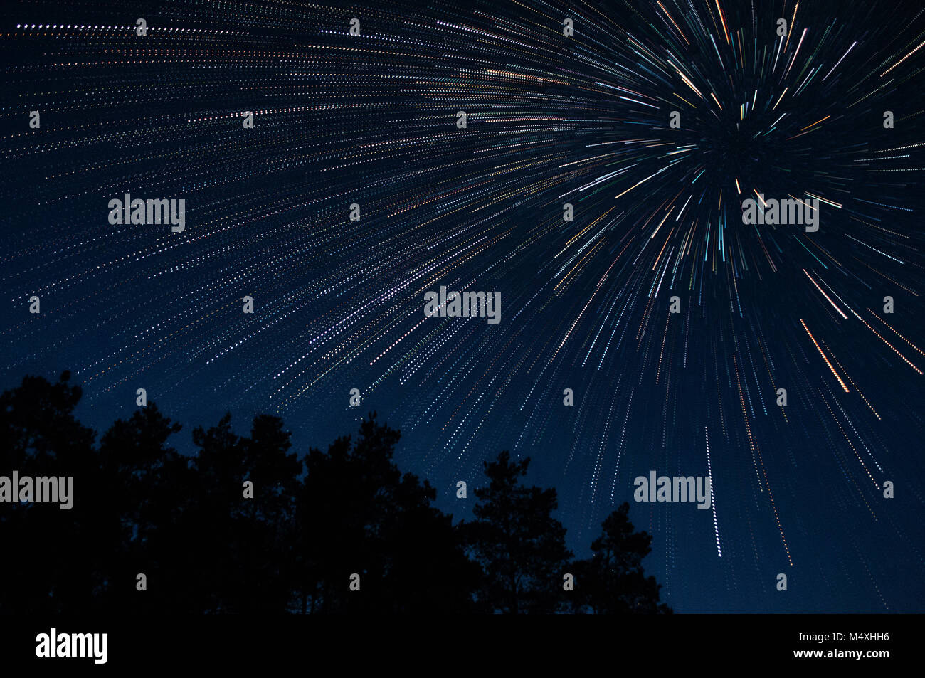 Beautiful night sky beautiful stars swirl above the trees, star trail ...
