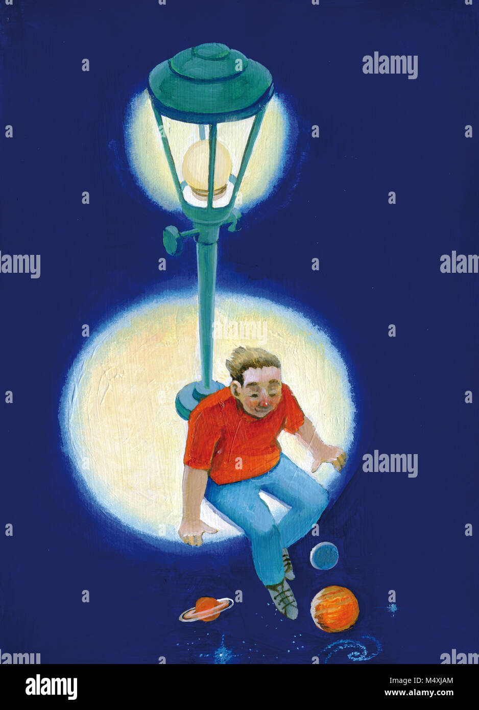 boy sitting in a circle of light from the lamp post lets his legs dangle in the dark where you can see the planets and galaxies Stock Photo