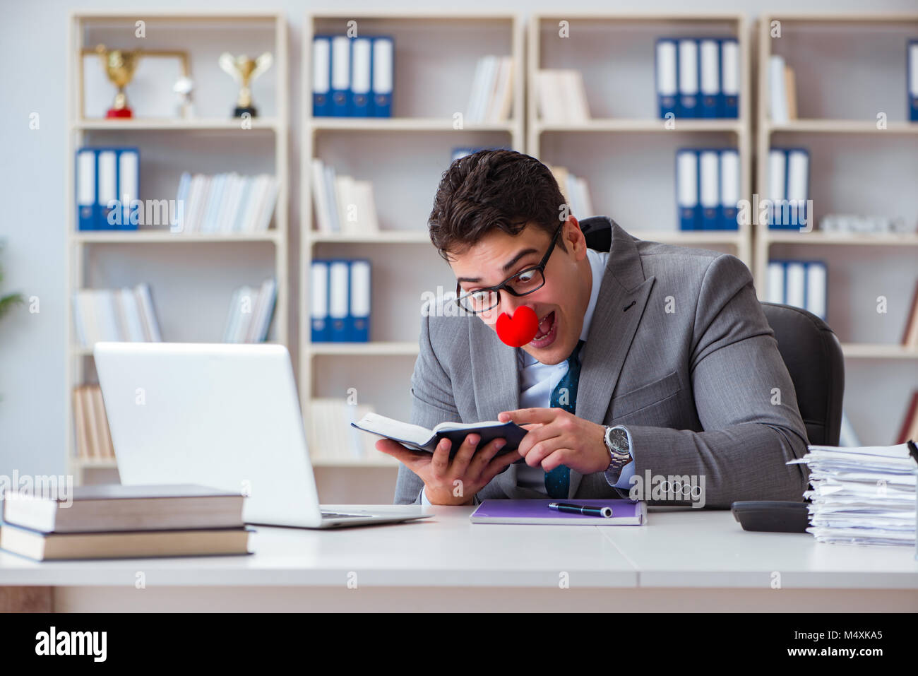 Work Cloan Clown businessman working in the office Stock Photo - Alamy