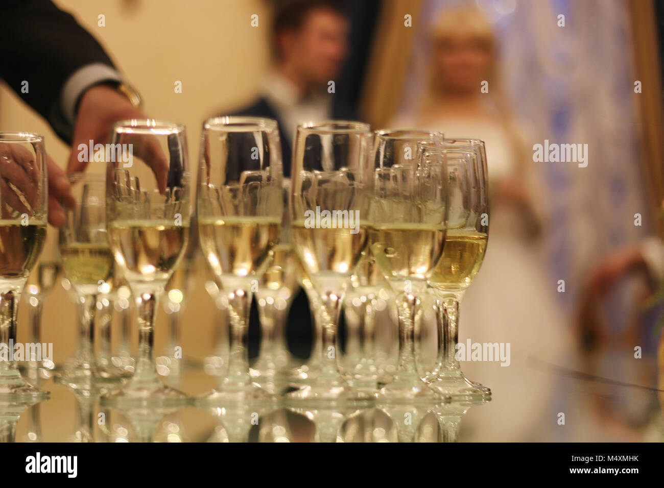 Wedding Accessories. Bridal bouquet and champagne glasses Stock Photo