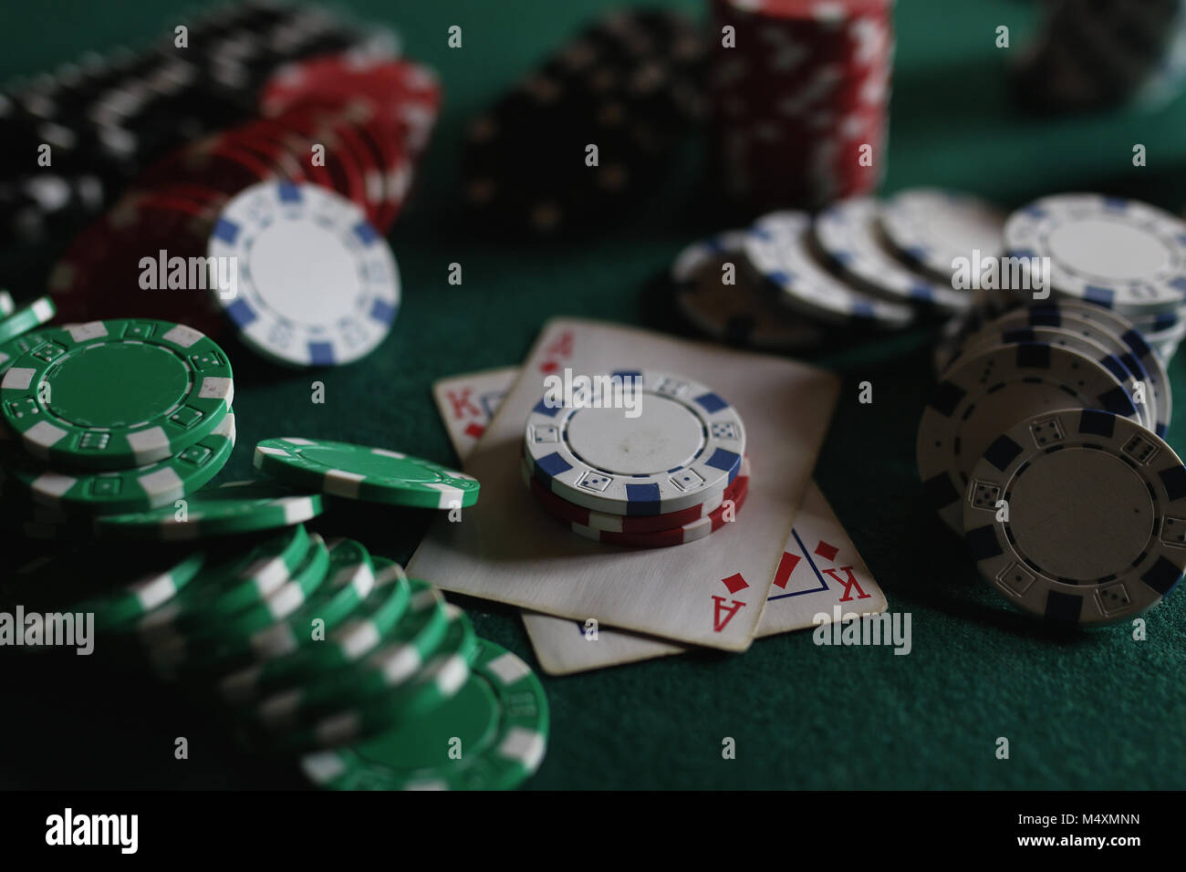 Poker chips and cards on the cloth Stock Photo