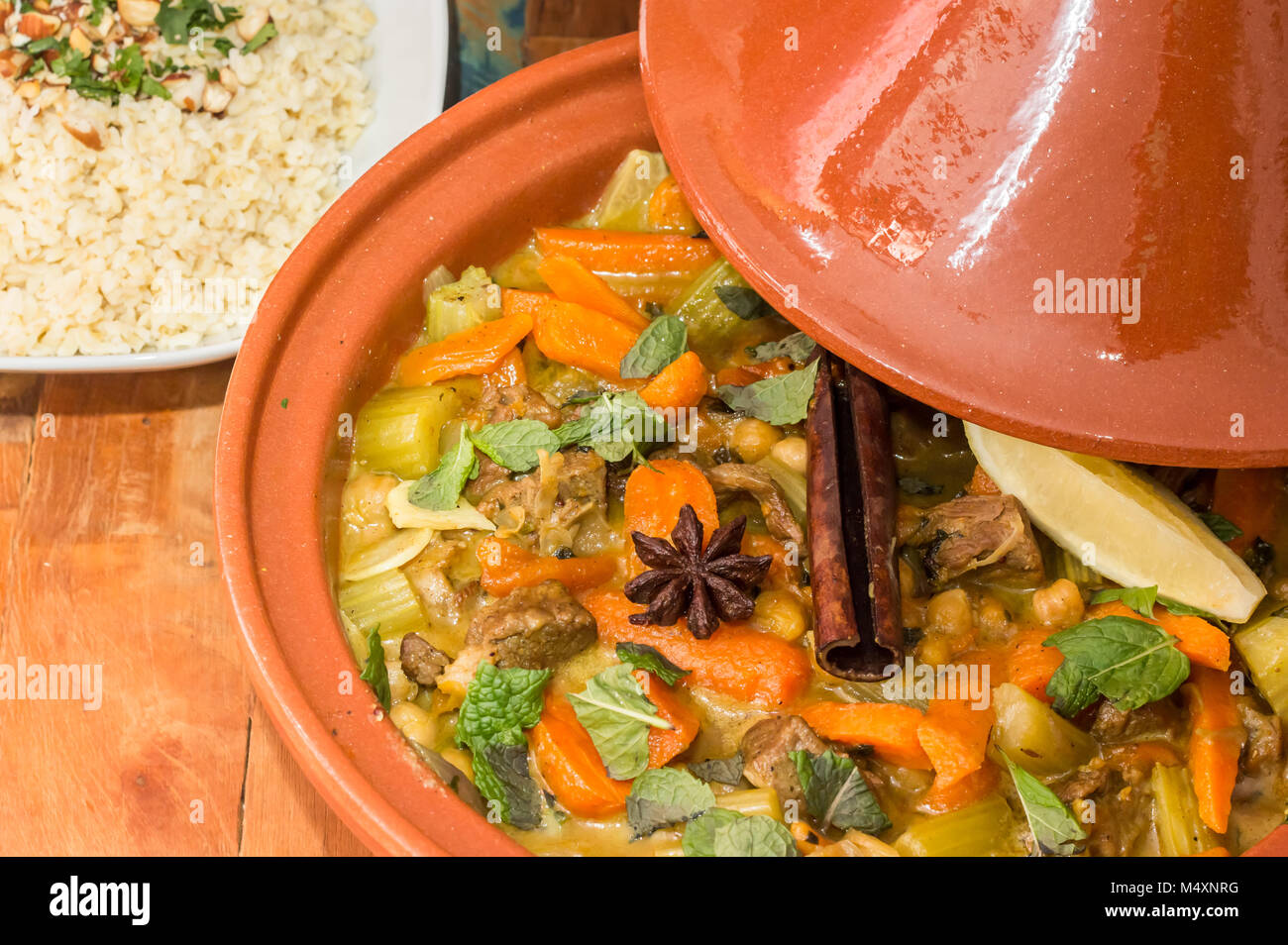 Moroccan tagine dish with chick peas, lamb, carrots, celery, lemon