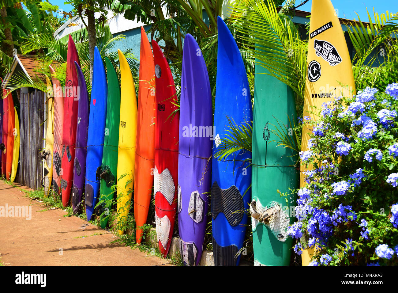 Fence in Paia on Maui, Hawaii made up of old surfboards and windsurf