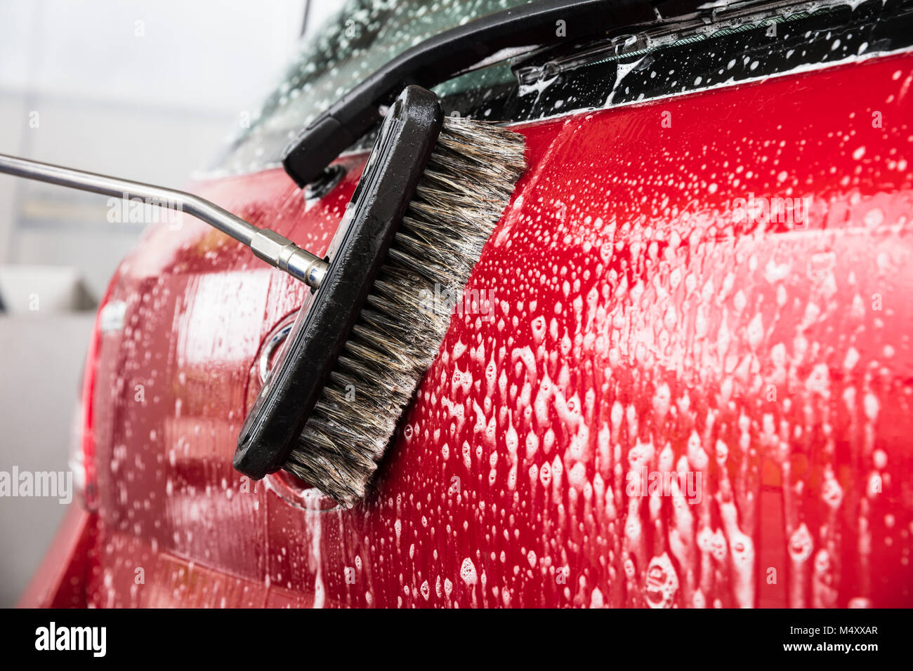 Close-up Of Person's Hand Washing Car Using Broom Stock Photo - Alamy