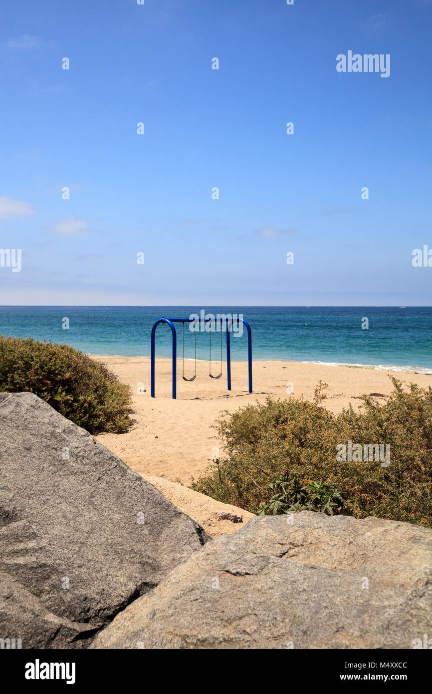 Swings on the sand at San Clemente State Beach Stock Photo