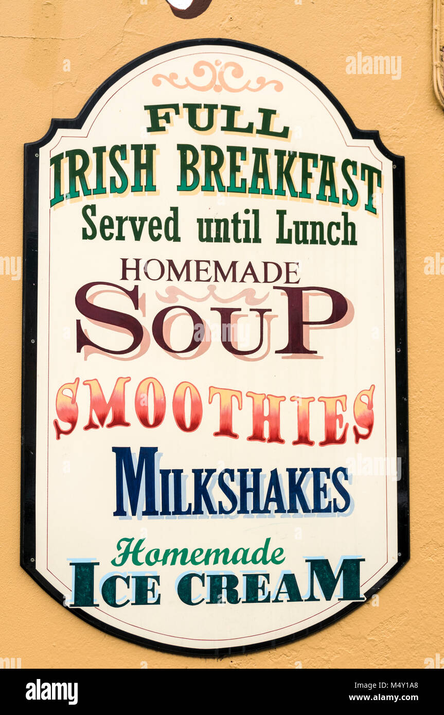 A menu display board outside a restaurant in the busy Henry Street in Kenmare in County Kerry, Southern Ireland. Stock Photo