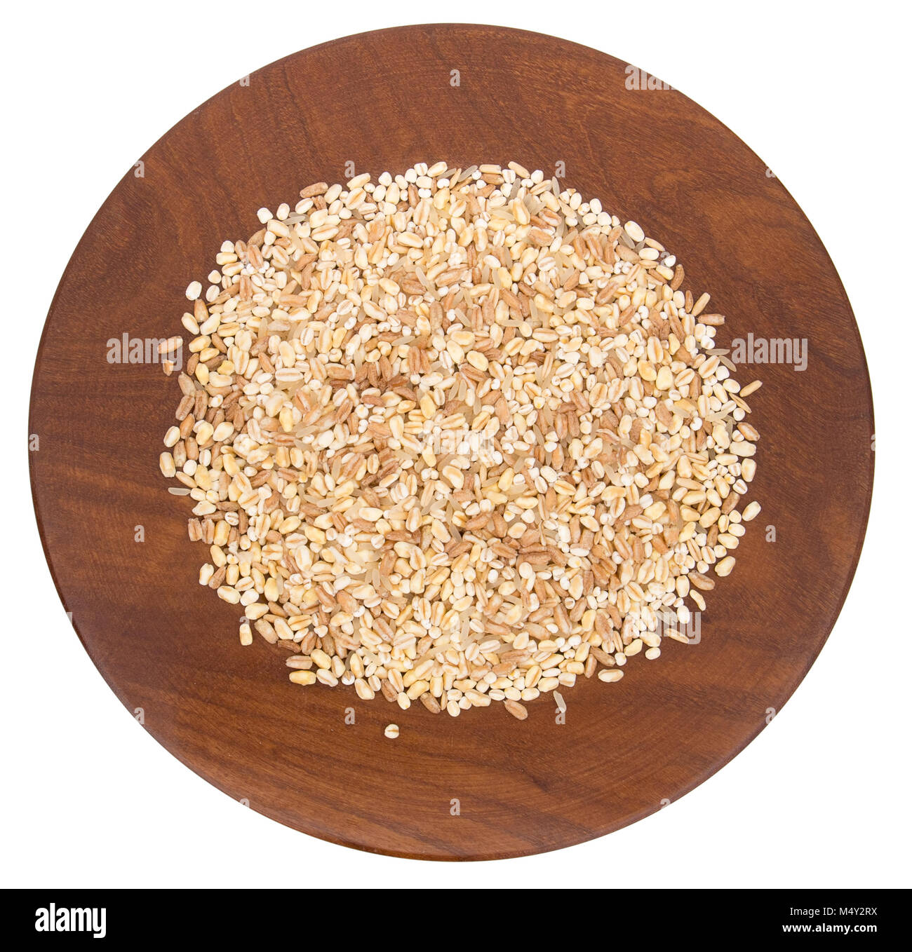 Mix grainson wooden plate. Wheat, oats, barley,rice, spelt. Stock Photo