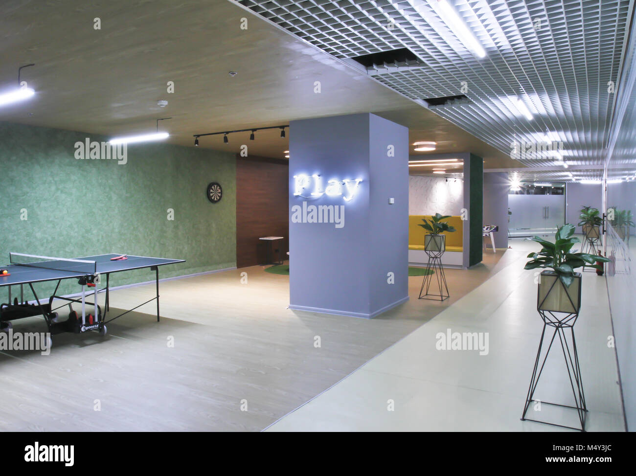 Interior of the staff rest room with a tennis table in the modern ...