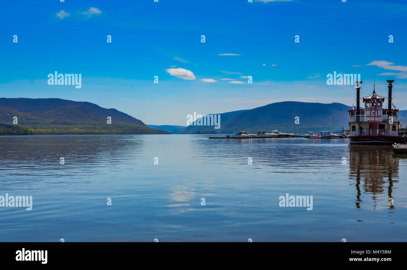 Red and white river boat and mountains reflected on the Hudson River in Upstate New York. Stock Photo