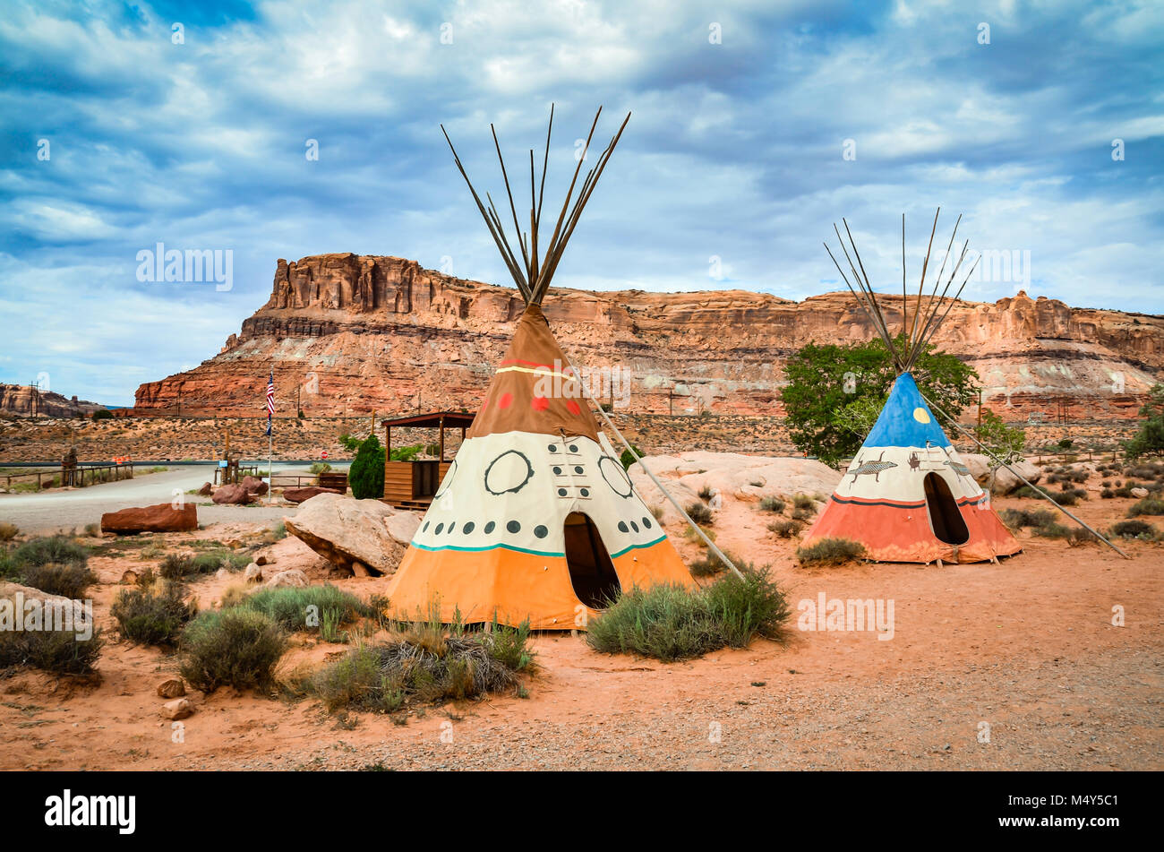 Two colorful hand-painted teepees at the entrance of Arches National Park in Maob, Utah remind visitors of the region's Native American heritage. Stock Photo